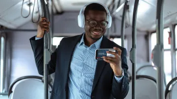 B2B professional watching video testimonial on smartphone during mobile research