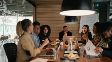 Live-action B2B workplace storytelling video production still with office workers