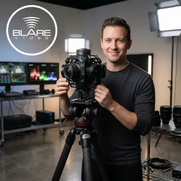 Videographer operating a 360-degree camera rig in a professional studio setting