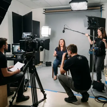 Documentary film crew interviewing a subject