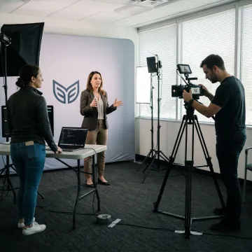 Training video crew filming in an Orlando office