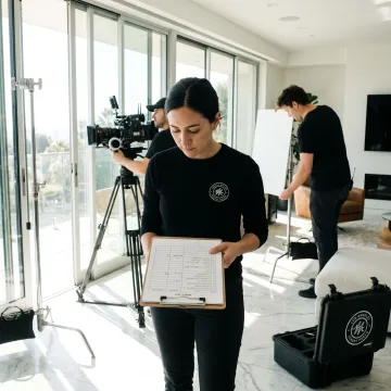 Real estate video crew planning a property shoot