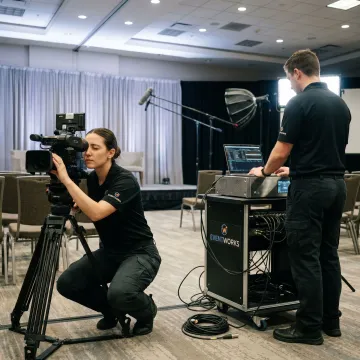 Technicians preparing live streaming equipment