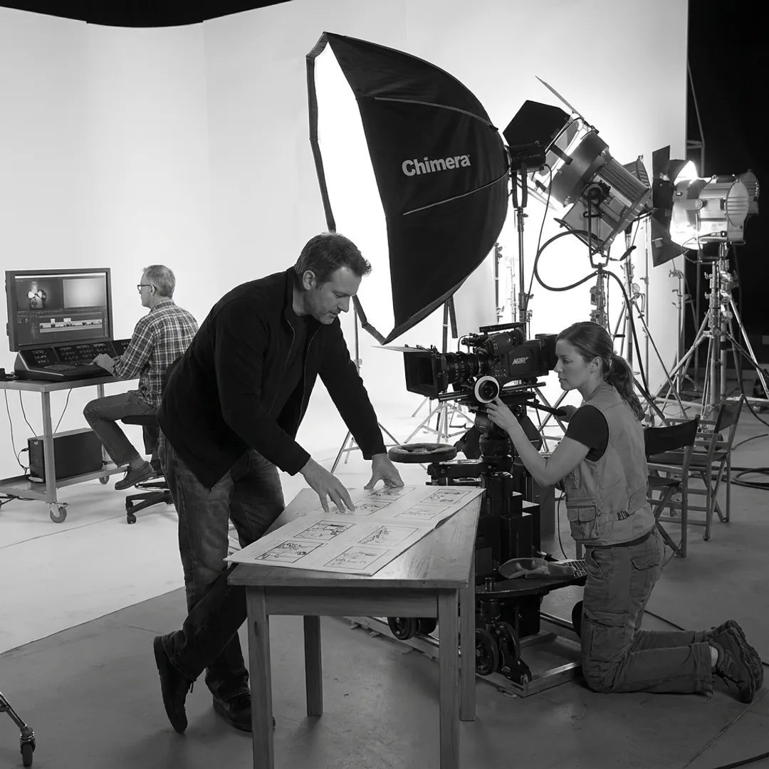 Production team planning and filming a brand video