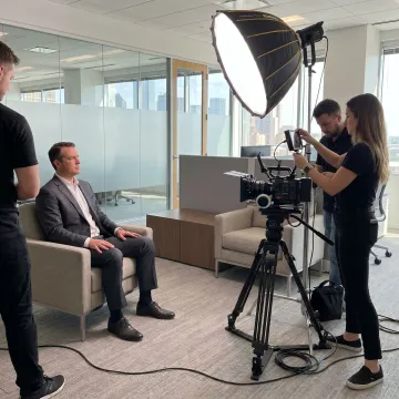 Corporate video crew filming in a Dallas office