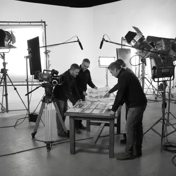 Video production crew planning and filming a Phoenix shoot