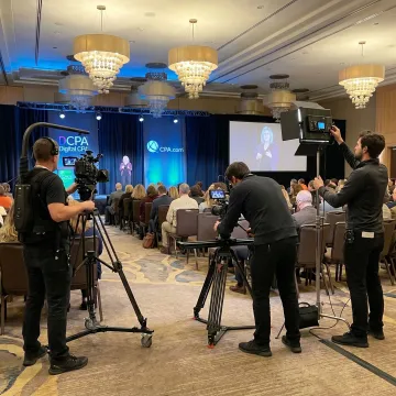 Corporate event videographer filming a Denver conference