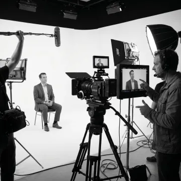 Corporate video crew filming an interview