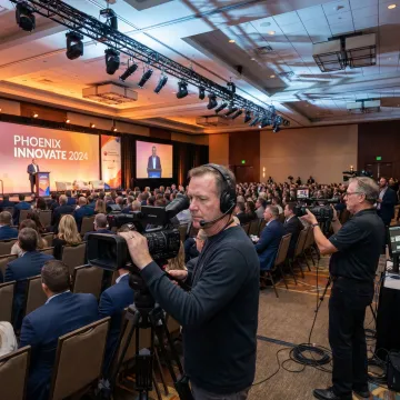 Camera crew filming a Phoenix corporate event