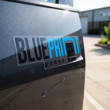 Custom weatherproof car sticker on a vehicle door