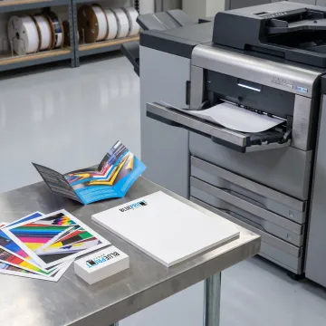 Professionally printed business documents on a worktable