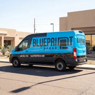Branded commercial van with colorful vinyl graphics