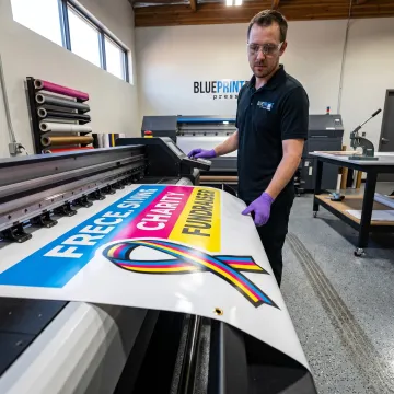 Printer preparing a colorful fundraising banner