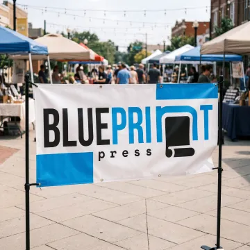 Custom 6 x 3 vinyl banner displayed at an event