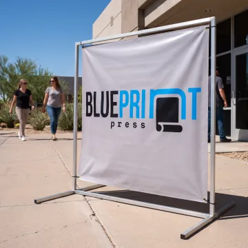 Custom outdoor banner displayed in a metal frame