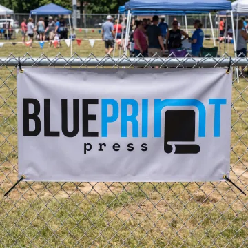 Custom vinyl 2x8 banner displayed outdoors