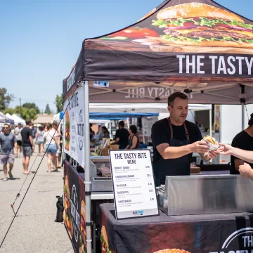Branded canopy tent at an outdoor food event