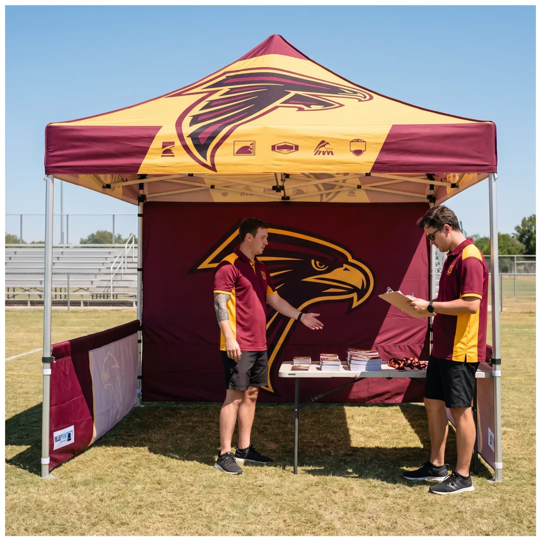 Team staff standing beneath a custom logo canopy tent