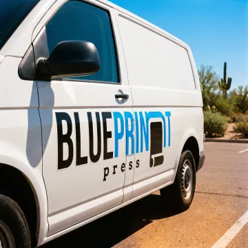 Custom vinyl logo decal on a business vehicle