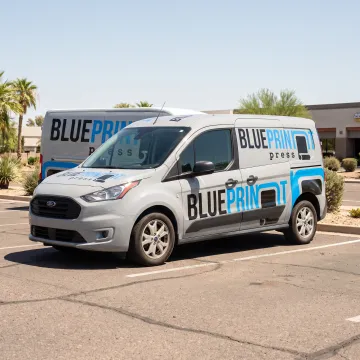 Branded vehicle wrap on a business car