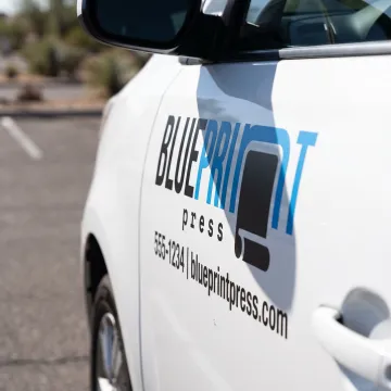 Custom vinyl lettering on a business vehicle