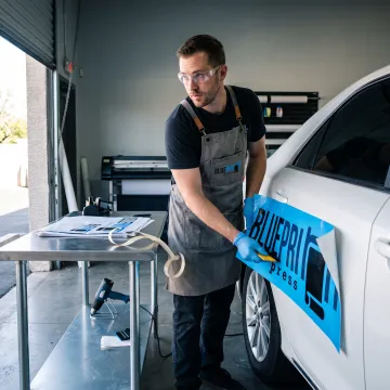 Printer preparing colorful vehicle decal graphics