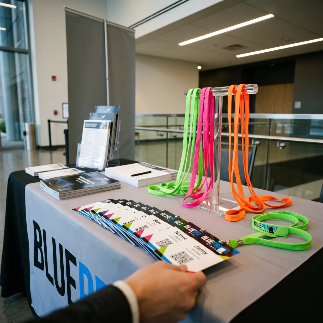 Custom neon lanyards used at an event registration desk