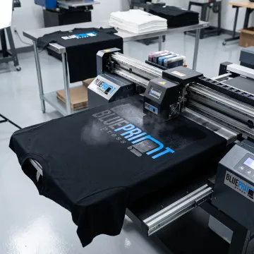 Custom graphic being printed on a black T-shirt