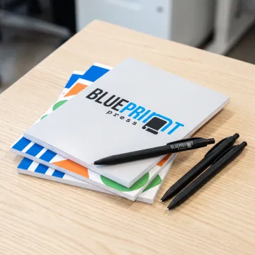 Custom branded notepads on a desk