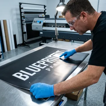 White logo printed on dark vinyl material