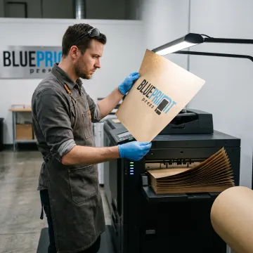 Printer preparing custom kraft paper sheets