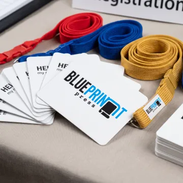 Custom square corner name badges on a conference table