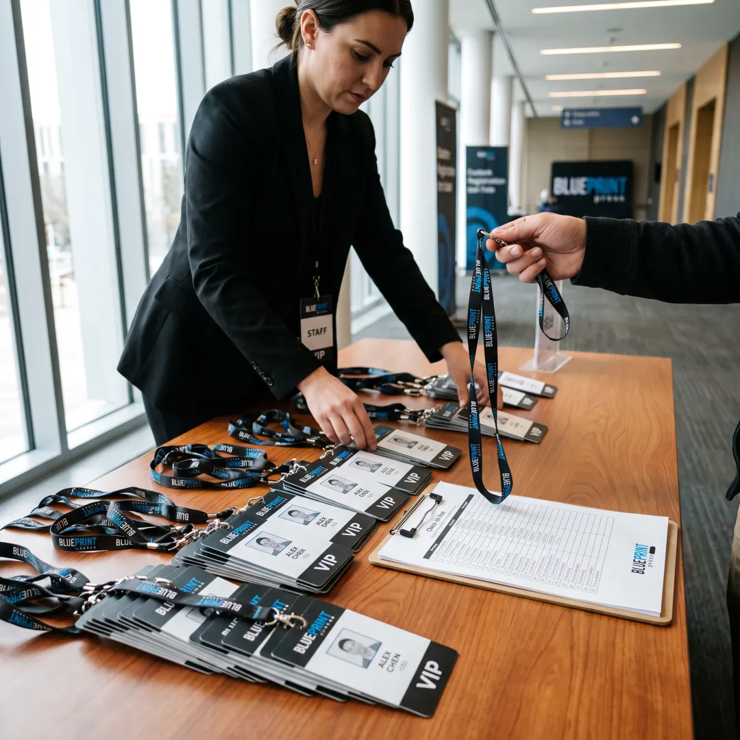 Event staff preparing custom VIP badges