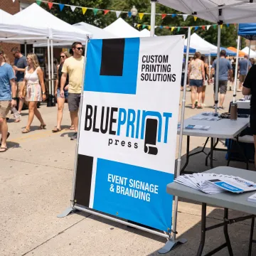 Custom 5x3 vinyl banner displayed at an event