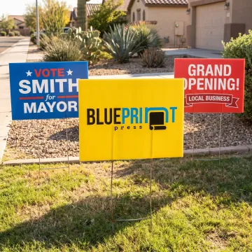 Colorful custom yard signs displayed on a lawn