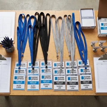 Branded lanyards and name tags at event check-in