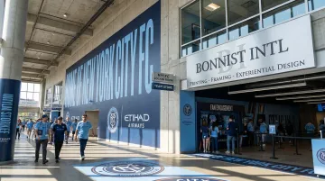 Sports venue branded corridor installation with acrylic photography graphics and dimensional signage