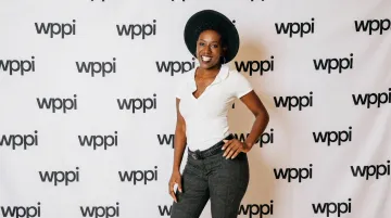 Fabric step and repeat banner at indoor press event with professional photography lighting