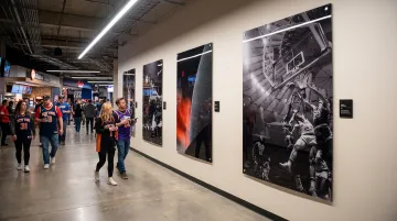 Large-scale acrylic print installation in sports arena corridor at MSG