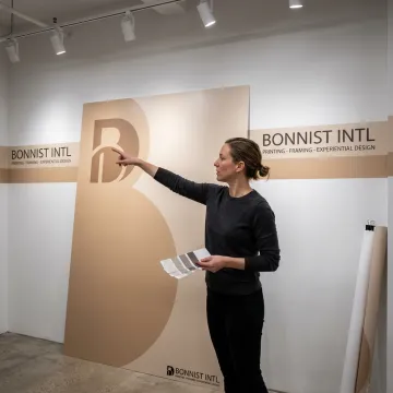 Designer reviewing vinyl wall mural installation plans