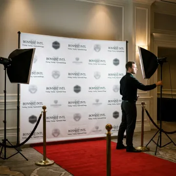 Step and repeat backdrop banner at a branded event