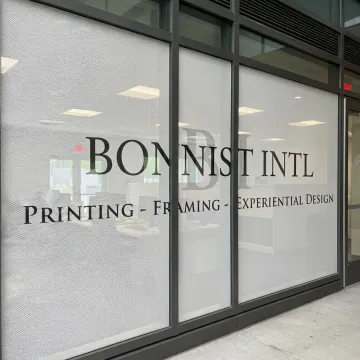Custom perforated vinyl window graphics on commercial glass