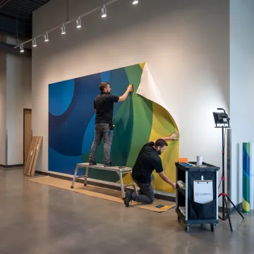 Team installing branded experiential display