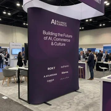 Curved tension fabric display with branded graphics