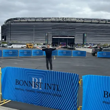 Custom barricade banners installed at a branded event perimeter