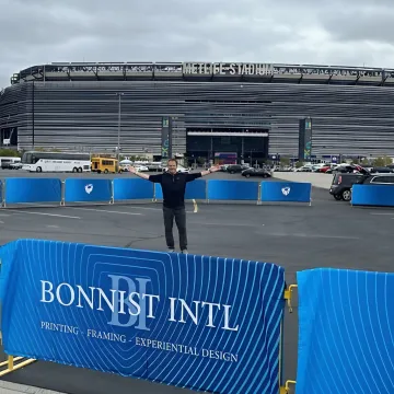 Branded barricade banners at a professional event venue