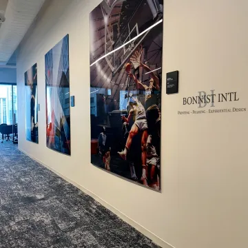 Custom acrylic wall art prints in a modern branded office