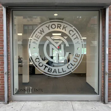 Double sided window clings on branded storefront glass