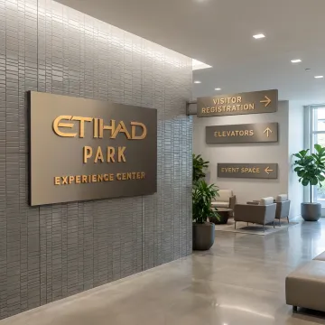 Modern interior wayfinding and directional signage in a branded lobby