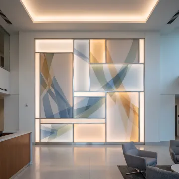 Custom backlit wall art in a modern lobby